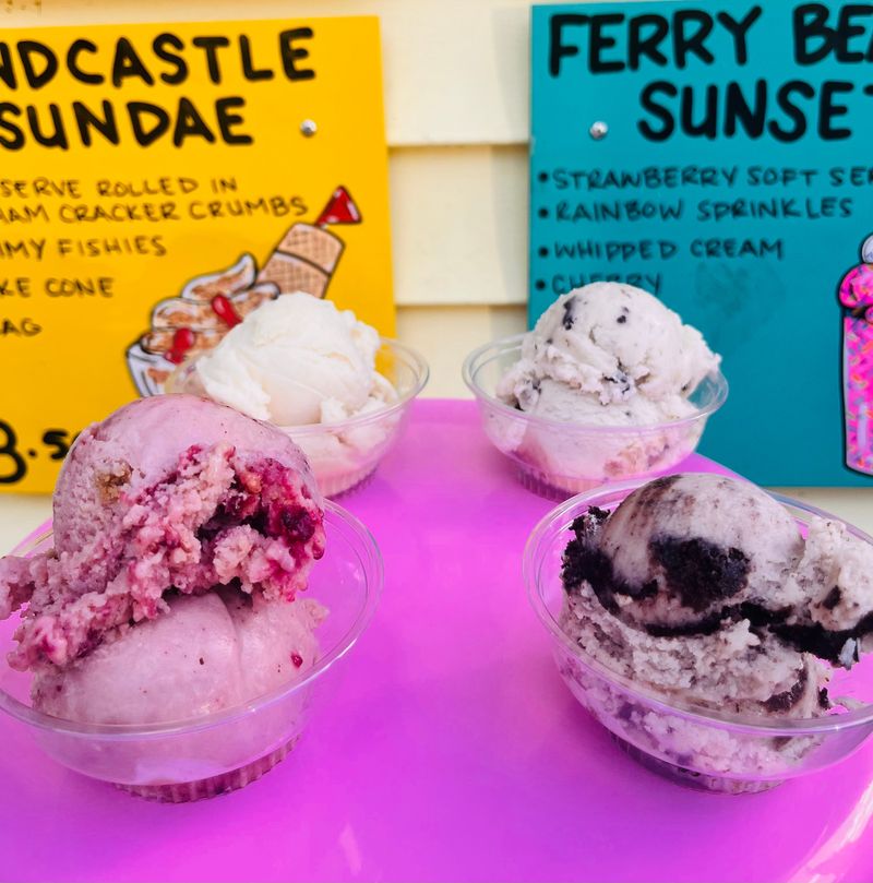 Scoops in cups on the counter with menu signs